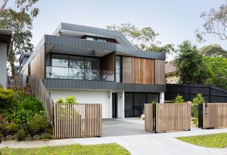 "The interlocking panel fascias look a little like the Nokia Snake game folding and raking between the two properties and sandwiching the layers of the house within them," says Jost.