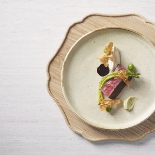 A beautifully plated Wagyu steak dish.