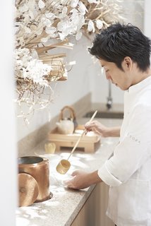 The counter seating has a stepped-down area for the chef, so his eye level is closer to the seated guests, which creates a sense of intimacy. 