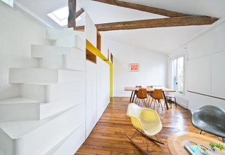 "The staircase is a great space saver, and we worked to give it an unusual presence," says Delaunay. "It seems challenging to climb to some, even though it is actually very comfortable. This helps define the space on the mezzanine as tucked away from the rest of the apartment, harder to reach, and private."