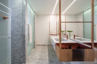 Di Marmore marble floors and walls clad the master bathroom.