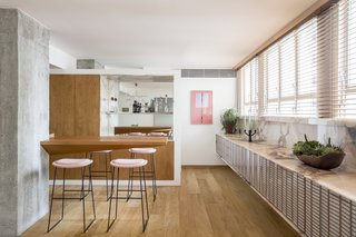 The dining area features marble countertops designed by Pascali Sermerdjian.