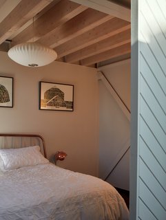 A bedroom with a light blue sliding door.