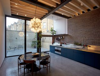 The open kitchen and dining area flows out to the courtyard.