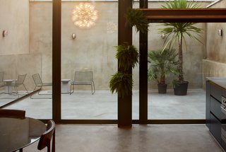 The outdoor terrace is rendered in concrete.