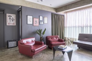 A Trienna black coffee table from Artek sits in the living room.