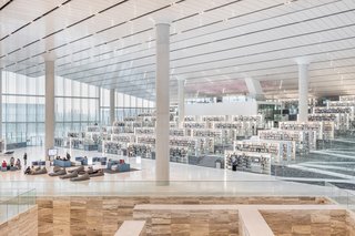 This majestic and modern library building has sides that lift at the edges to form a diamond-shaped profile, and an interior that’s arranged around three aisles of book shelves that enclose a central, triangular space. "The idea was to make reading as accessible and as stimulating as possible to the population of Qatar," says architect Rem Koolhaas. "We thought we could achieve that by creating a building that was almost a single room."