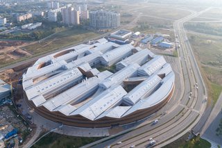 The first building that’s part of a new tech campus being developed, the Skolkovo Institute of Science and Technology University’s East Wing Building is designed in the form of a massive, partially filled ring with a 919-foot diameter, and jigsaw-like roofline. 