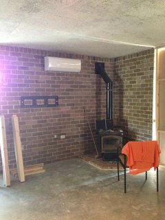 A corner fireplace before the renovation.