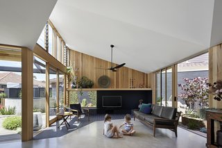 Brick paving crosses the threshold, blurring the boundary between inside and out. 
