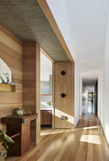 Light wood floors and cabinetry give the space a bright, contemporary atmosphere.