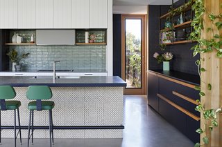 Different surface materials create textural richness in the kitchen.