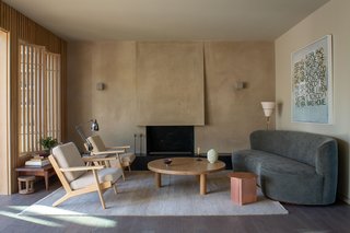 The wall paneling and living room screens are a waxed white oak.