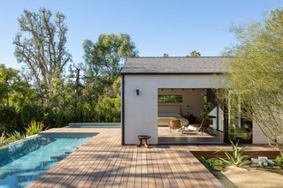 The large master suite has soaring ceilings and walls of glass.