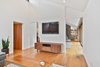 Modern home with Living Room, Coffee Tables, Console Tables, Sofa, Medium Hardwood Floor, and Ceiling Lighting. Den Photo 15 of Portola Valley