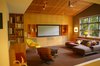 Modern home with Living Room, Bench, Chair, Sofa, Sectional, Recliner, Ottomans, Bookcase, Shelves, Storage, Ceiling Lighting, Floor Lighting, Track Lighting, Media Cabinet, Carpet Floor, and Terrazzo Floor. Den Photo 2 of Alamo