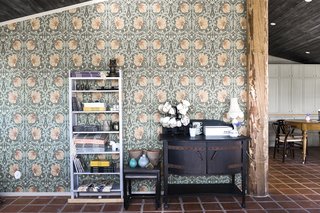 An old log makes for a great divider. Beautiful wallpaper from William Morris