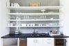 Modern home with Kitchen, Engineered Quartz Counter, White Cabinet, Mosaic Tile Backsplashe, Beverage Center, Refrigerator, Wine Cooler, and Drop In Sink. Bar Photo 6 of Bahamian Retreat