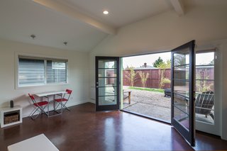 In the 470-square-foot ADU, wide French doors open up to a patio and fire pit. 