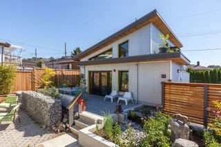 The ADU shares the backyard of the main home, but gabion retaining walls (rocks in wire cages) and an elevated terrace give it an intimate space of its own. 