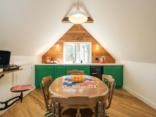 The space includes a kitchenette and dining area.