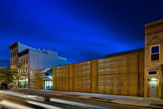 A trademark facade of laser-cut Cor-Ten steel marks The Wyckoff Exchange, a former abandoned warehouse in the Brooklyn neighborhood of Bushwick. The panels are laser cut with a dynamic gradient pattern and internally illuminated by concealed LED lighting to create a dramatic building facade.