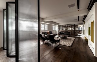 Natural Theme - Photo 11 of 17 - The movable divider made of opaque glass was used in the guest room. It can be opened up to transform the guest room into a playroom for the family children of similar ages or be closed up to provide a private space for the guests.