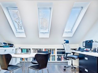Lack of insulation and ventilation didn't prevent this Canadian attic from becoming a top-of-the line workspace for the townhouse's owners. 