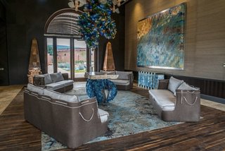 16' 6" ceilings allowed for oversized chandeliers to be used in community spaces; Mexican and modern design are expertly juxtaposed through wood and hand-blown glass. 