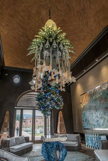 The reclaimed wood ceiling has agave bees carved into in order to represent their importance in the local production process for Tequila. 