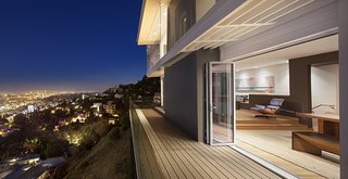 The pre-existing French doors and large windows were not maximizing on the stunning panoramic views at this Hollywood CA residence. During a renovation project, the space was transformed with jaw dropping results.