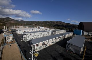 Shigeru Ban is renowned for his disaster relief design work and use of environmentally conscious and unconventional materials. When the town of Onagawa in Miyagi Prefecture suffered extreme damage from the earthquake and tsunami on March 11, 2011, Ban responded by designing a multi-story temporary housing complex for survivors using shipping containers.