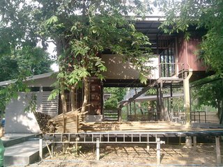 How to Buy a Shipping Container - Photo 10 of 12 - This beautifully designed container home with an incredible backdrop was built with a mixture of 20- and 40-foot shipping containers by architect Narongdej Nilapat.