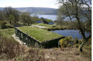 Part of the "big isle" of Britain, Scotland's Cove Park is a center for established artists situated in 50 acres of spectacular countryside. In 2002, Container City created three en-suite accommodation units (known as "cubes") to act as artist retreats. In order to blend into the rural surroundings, sliding glass doors were installed that lead out onto the decked balcony that extends over a lake with beautiful views of Loch Long.