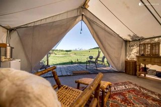 This unique safari tent can be found near White River National Forest, Colorado, and is perfect for a glamping getaway. The tent features a beautiful California king four-poster bed that guarantees a peaceful sleep. There is also a deck where guests can enjoy soaking in the beautiful views. 