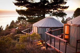 Treebones's yurts have plush, comfortable beds with linens, cozy comforters, and colorful quilts. There is a small table and set of chairs, reading lights, and plenty of hooks for hanging your gear. There is a sink vanity with hot and cold running water in each yurt with bath and hand towels provided. The yurts have generous redwood view decks with Adirondack chairs.