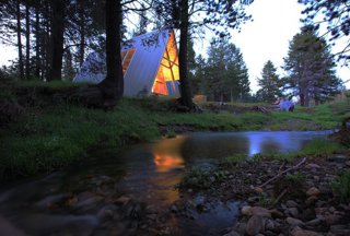 This modern A-frame is in a beautiful remote location in California's Sierra National Forest at an elevation of 7,000 feet. Siting 14 miles above Bass Lake on the Sierra Vista Scenic Byway, this property is surrounded by amazing meadows, secret swimming holes, and miles and miles of undiscovered hiking trails. It's your own private Yosemite without the crowds.