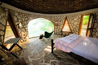 Jackie’s was created as a small temple of no particular faith and is an eco-friendly, locavore environment amidst organic gardens overlooking 180 degrees of the majestic Caribbean Sea. The Dome is their newest addition: sleep in a stone geodesic dome right on the sea. The design was created by Buckminster Fuller. After being destroyed by hurricane Ivan in 2004, the Dome was reconstructed using corals.