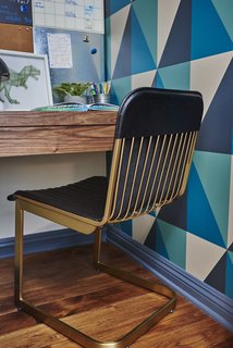  Geometric wallpaper in navy, teal and oatmeal creates graphic appeal in the boys' bedroom.