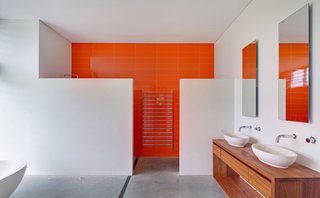 A bold color on one wall makes all the difference in brightening this otherwise blank space.