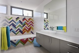 No need to stick to a single color; a bold, multi-hued mosaic effect here, combined with the primary colored towels makes the difference. Exactus was established by Ralph Brewer, a builder with over 25 years experience in the industry. 