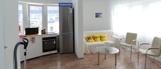 Samsung provided high-tech appliances, including a TV set with the same radius of curvature as the curved walling of the house. 