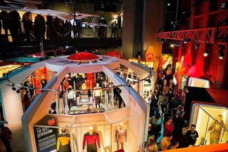 in 2017 the "Star Trek: Exploring New Worlds" was a featured exhibition at the Museum of Pop Culture. The Paul G. Allen museum has organized more than 57 exhibitions, 20 of which have traveled nationally and internationally. The museum, known for its futuristic Gehry design, also hosts more than 100 arts and cultural events each yea. The "MoPOP" is housed in a 140,000-square-foot building set amid the backdrop of the Seattle Center. It was built with more than 21,000 aluminum and stainless steel shingles and 280 steel ribs.