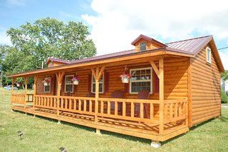 10 Prefab Log Home Companies - Photo 2 of 10 - Amish cabin homes come in five standard models that are available prefbuilt or as unassembled kits. Prebuilt homes can be basic, which gives the customer an open-floor plan and an unfinished interior—and they're great for those working within a limited budget. The deluxe prebuilt versions are fully finished on the inside featuring bedrooms, bathrooms, a kitchen, insulation, electric setups, and more. 