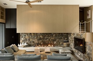These 4 Modern Homes Around the World Take Advantage of Local Stone - Photo 4 of 16 - Local stone was used also used on selective interior walls, reflecting the exterior facade.