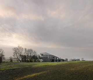These 4 Modern Homes Around the World Take Advantage of Local Stone - Photo 10 of 16 - From a distance, the fading of the flint reflects the range of colors of the outlying landscape.
