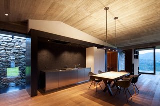Inside, views of both the old stone wall and the landscape beyond are emphasized.
