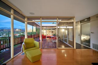 A Midcentury-Modern Home in L.A. Designed by Richard Banta Is For Sale For $899K - Photo 6 of 13 - Sunlight is maximized throughout the home, thanks to sliding glass doors with glass transoms above.