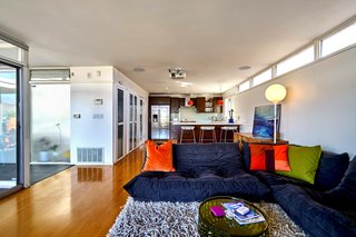 A Midcentury-Modern Home in L.A. Designed by Richard Banta Is For Sale For $899K - Photo 11 of 13 - An updated kitchen with stainless-steel appliances and a breakfast bar round out the modern updates to the home.