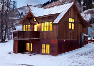 Based in Poncha Springs, Colorado, Great Western Homes designs and builds a range of homes that have a modern, rustic edge. By mixing materials—wood, weathered steel, and a standing seam metal roof—this residence is a modern take on a classic cabin, with steeply pitched roofs for shedding snow.